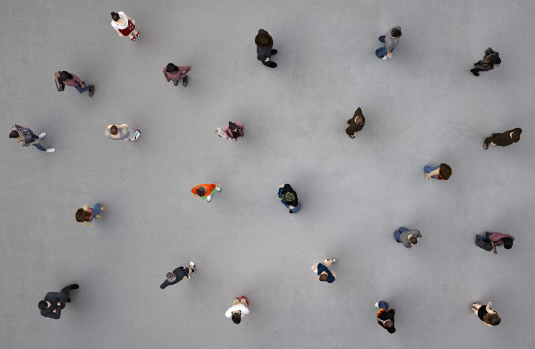 Diverse people walking on grey pavement, aerial view, emphasizing digital marketing audience targeting for businesses.