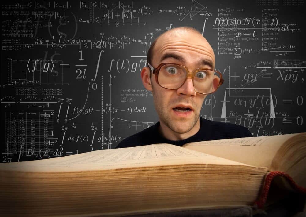 Man behind open book surrounded by complex mathematical formulas on blackboard, representing strategies for digital marketing analytics.